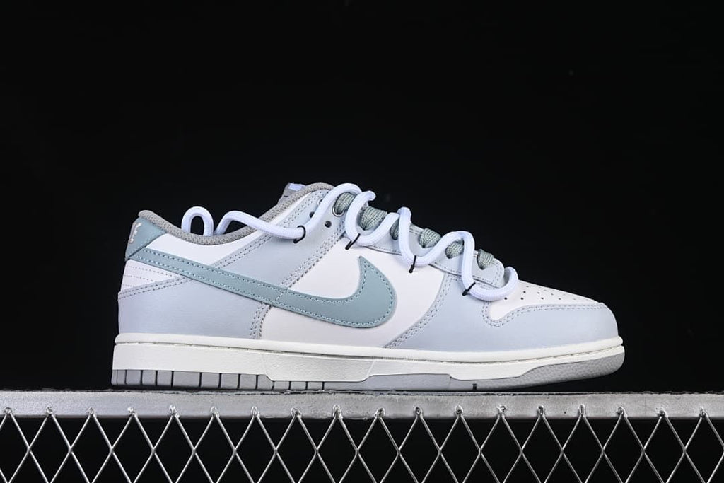 Side profile of the white and light blue sneaker