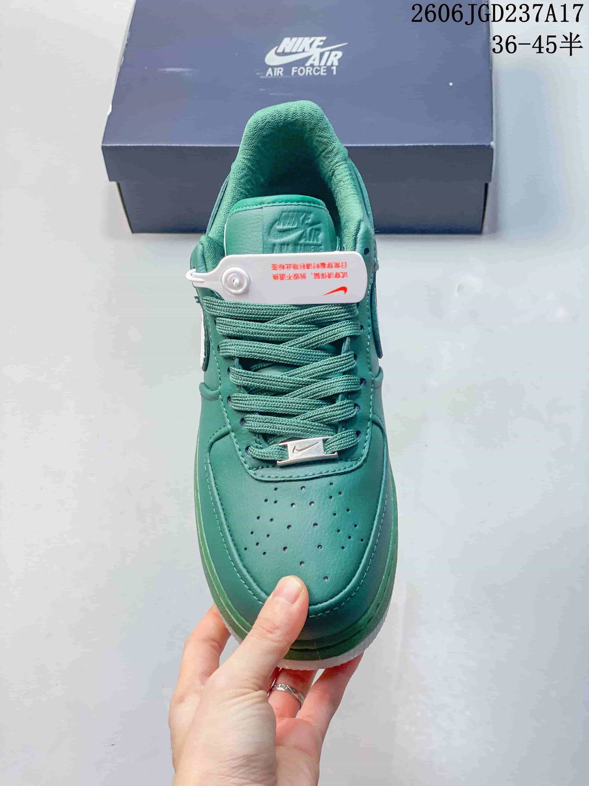 Top view of a teal sneaker showing the perforated toe, laces, and tongue.