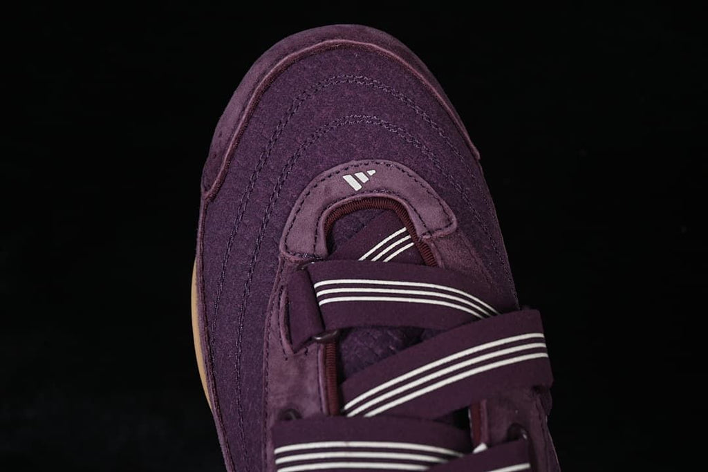 Top-down close-up of the sneaker toe and layered strap design