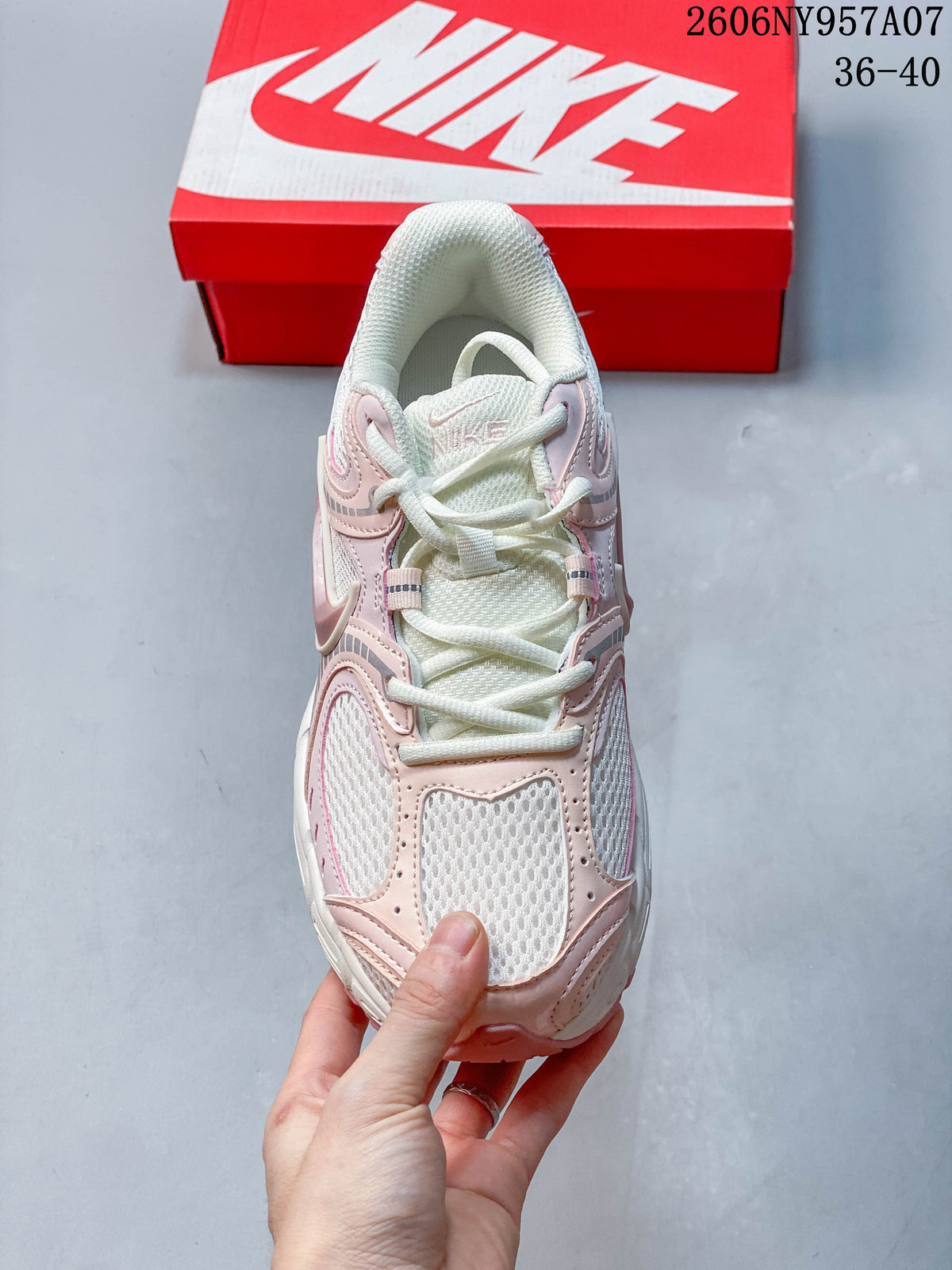 Top view of a pale pink and white Nike V5 RNR sneaker with lace-up fastening