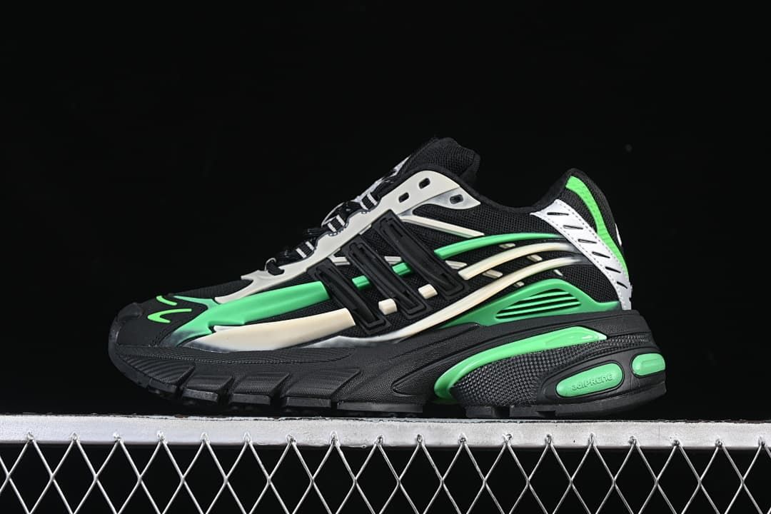 Side profile of the sneaker in black with bright green and off-white accents
