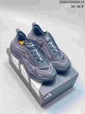 Pair of gray Adidas Holo Peak low-top trail running shoes on a shoebox
