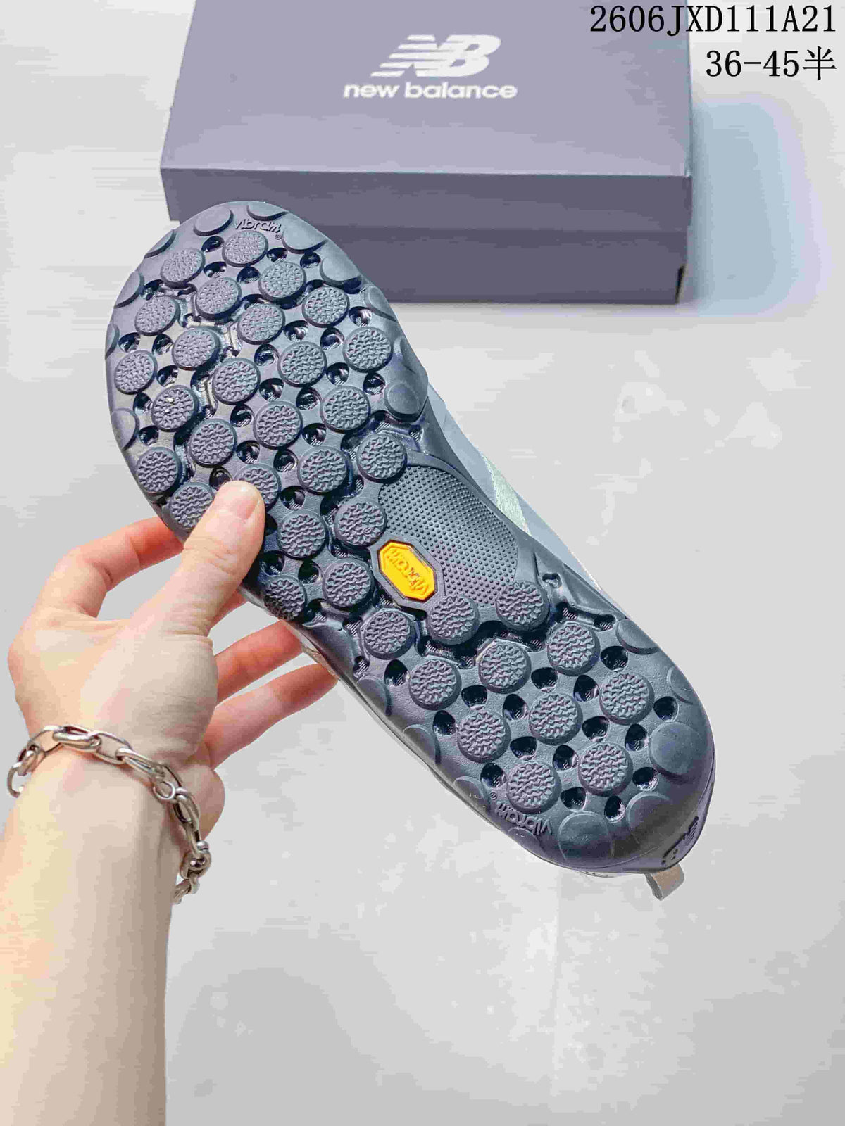 Underside of the sneaker showing a patterned outsole with round elements