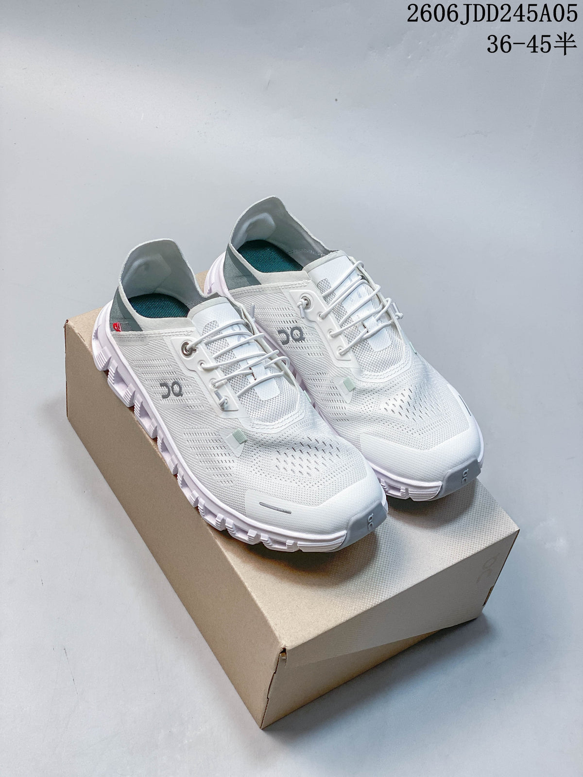 Pair of white On Cloud 6 Coast low-top shoes with pale blue-gray accents, shown from above and beside the box.