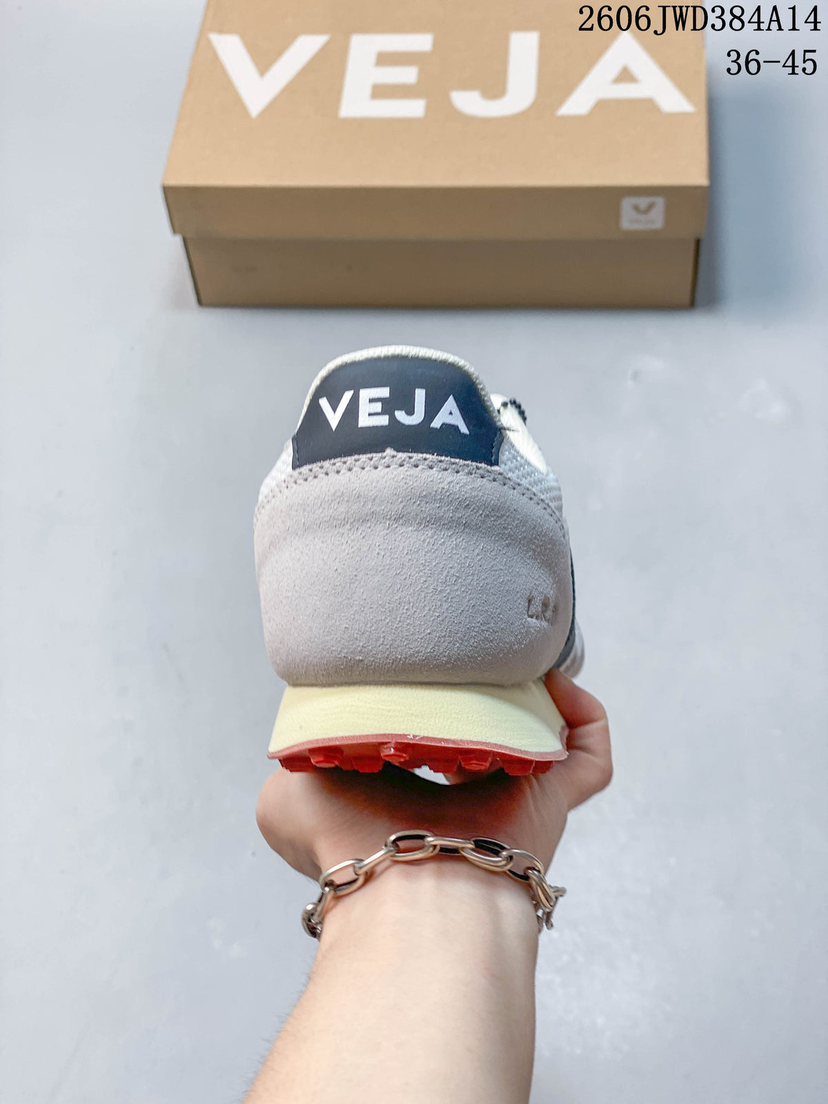 Rear view of a Veja sneaker with a gray heel panel and navy heel tab