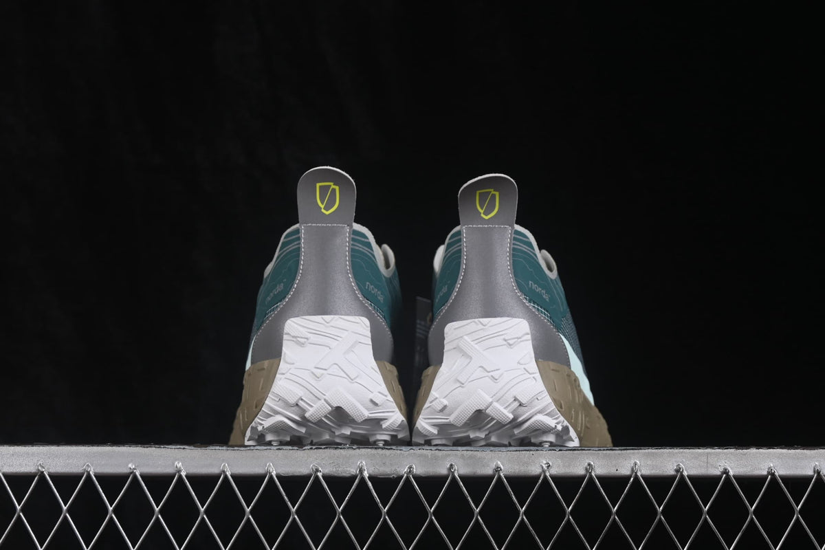 Rear view of the pair showing gray heel panels, pull tabs, and white outsole sections.