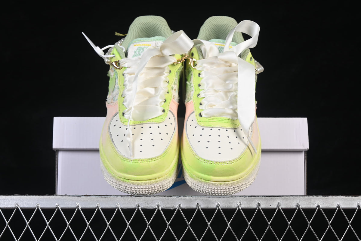 Front view of the pair showing ribbon-style laces and perforated toe boxes