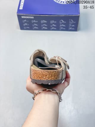 Rear view showing the heel area, back strap and layered sole construction.