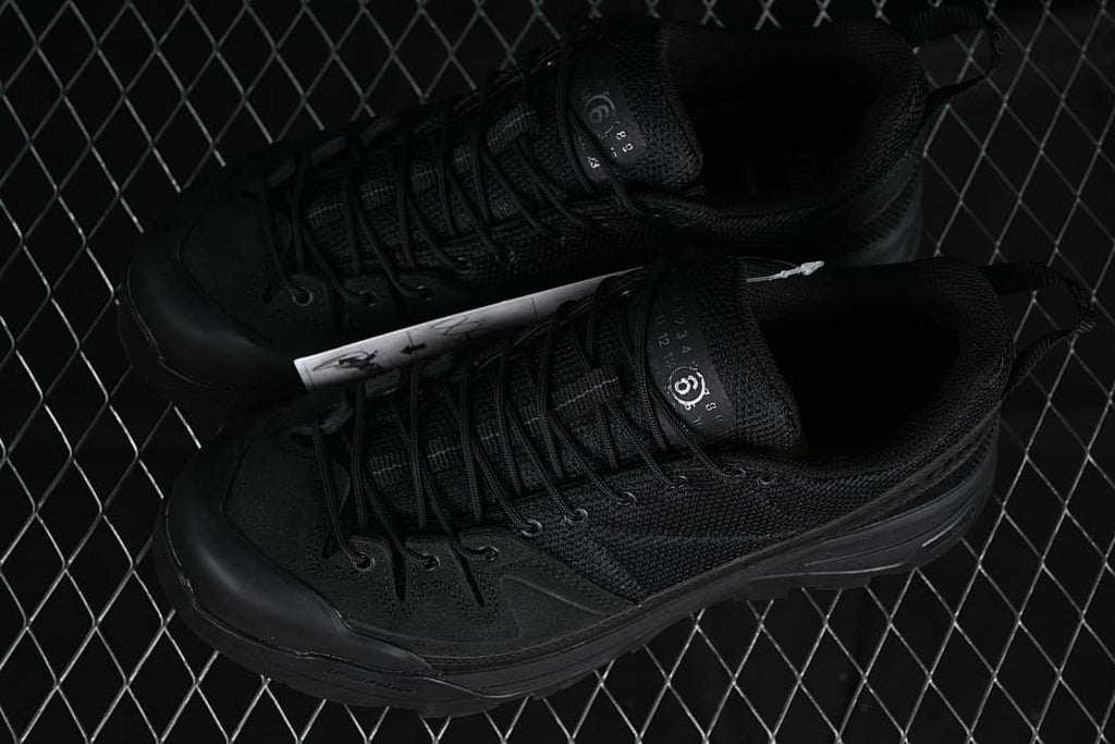 Pair of black Salomon X-ALP MM6 sneakers viewed from above