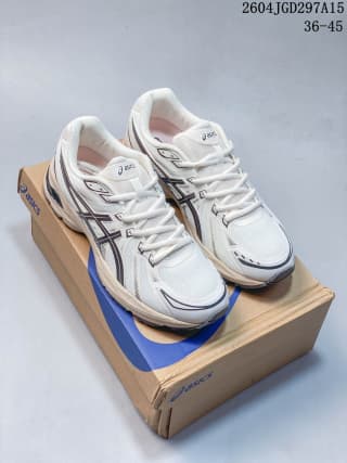 Pair of white ASICS Gel-Flux CN shoes displayed on a branded shoe box.