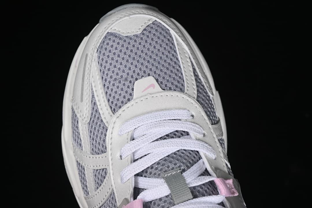Top-down close-up of the sneaker toe, mesh, and laces.