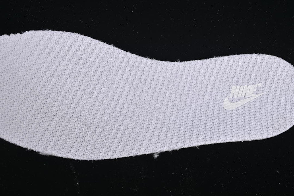 Close-up of a textured shoe insert with a Nike logo