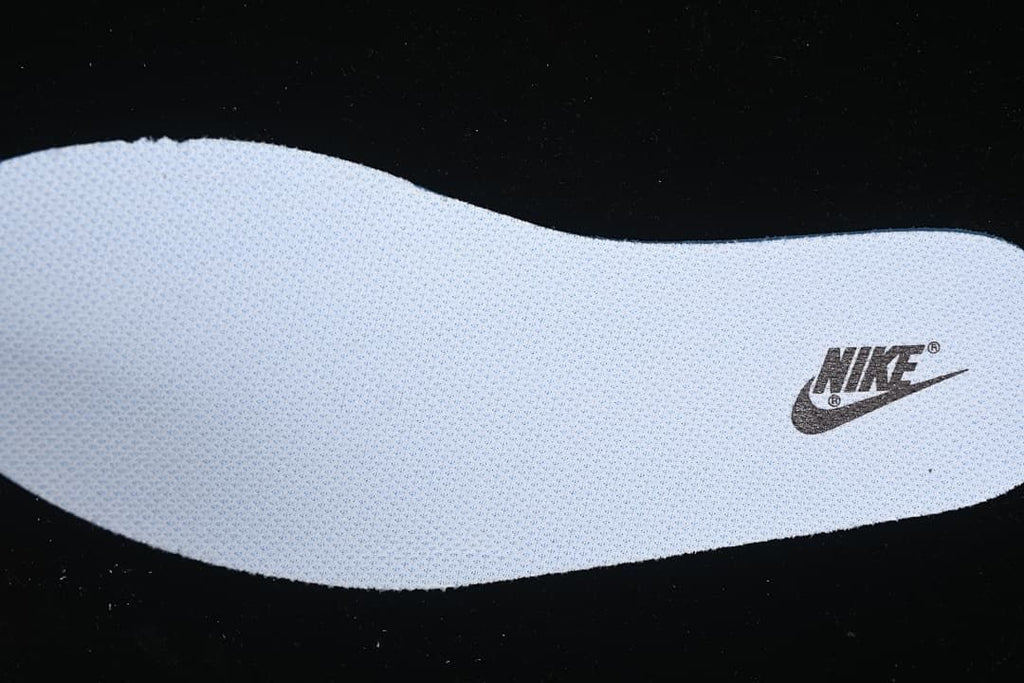 Close-up of a textured insole with a printed logo