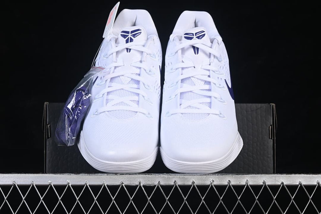 Front view of the pair with purple tongue logos and an extra lace set