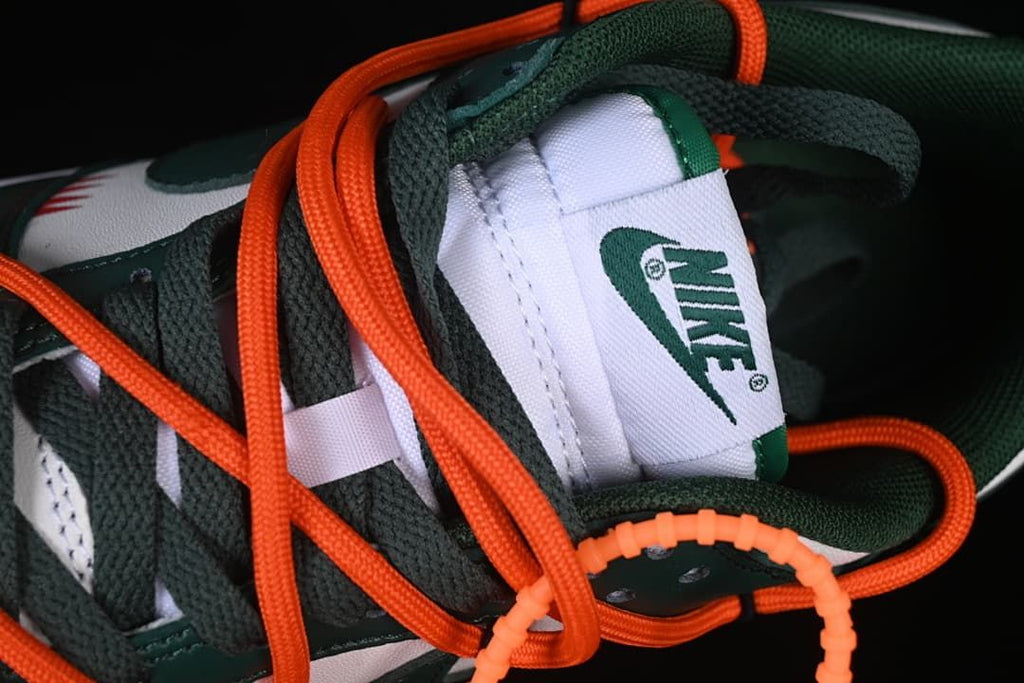 Close-up of tongue label and layered orange and green laces