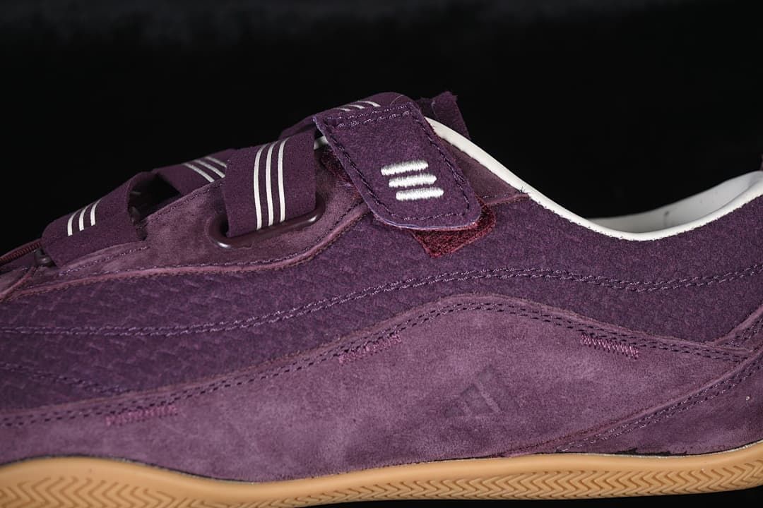 Close-up of the sneaker’s purple side panels and hook-and-loop straps