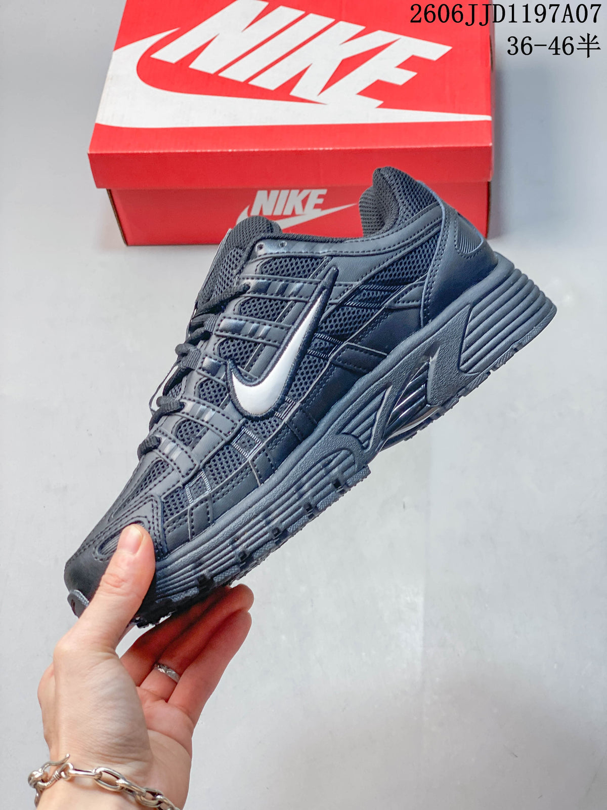 Side view showing layered panels and a light-colored Swoosh accent