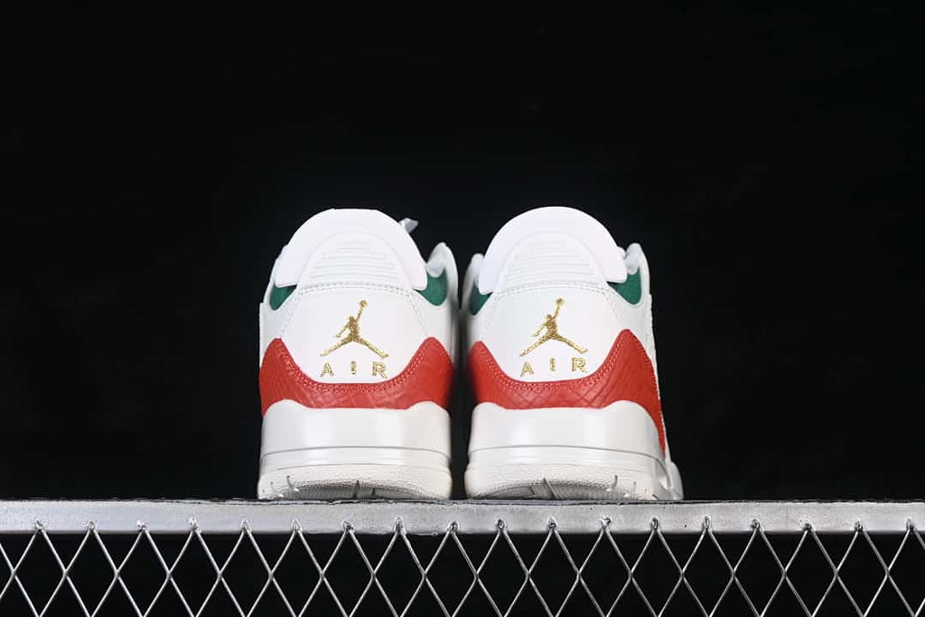 Rear view of the pair showing red and green accents and gold-tone heel emblems