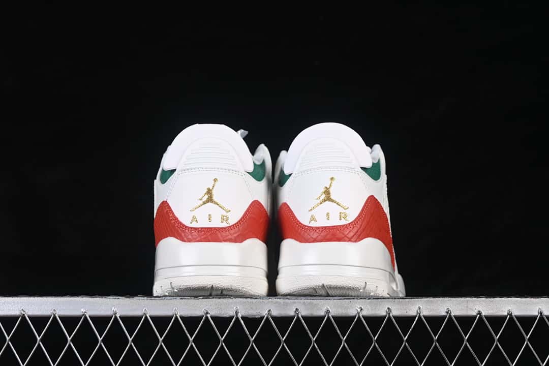 Rear view of the pair showing red and green accents and gold-tone heel emblems