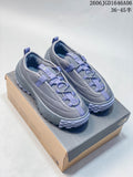 Pair of gray The North Face mule shoes with lavender accents, shown from above on a shoebox