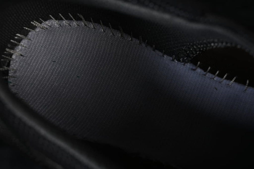 Close-up of a dark interior shoe panel