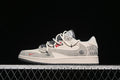 Side view of a light beige and grey patterned low-top sneaker with cream laces and a dark outsole