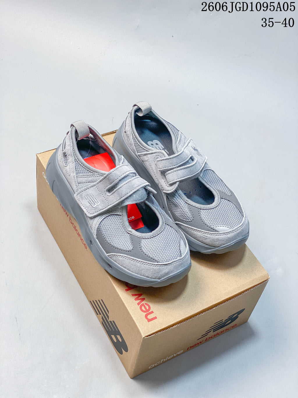 Pair of gray New Balance Breeze Mary Jane sneakers with mesh panels and hook-and-loop straps