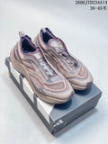 Pair of mauve and gray Adidas Holo Peak trail running shoes on a shoebox