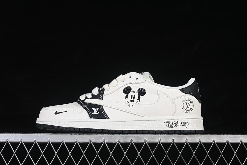 Side view of a white and black low-top sneaker with Mickey Mouse graphics and character details on the midsole.