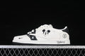 Side view of a white and black low-top sneaker with Mickey Mouse graphics and character details on the midsole.