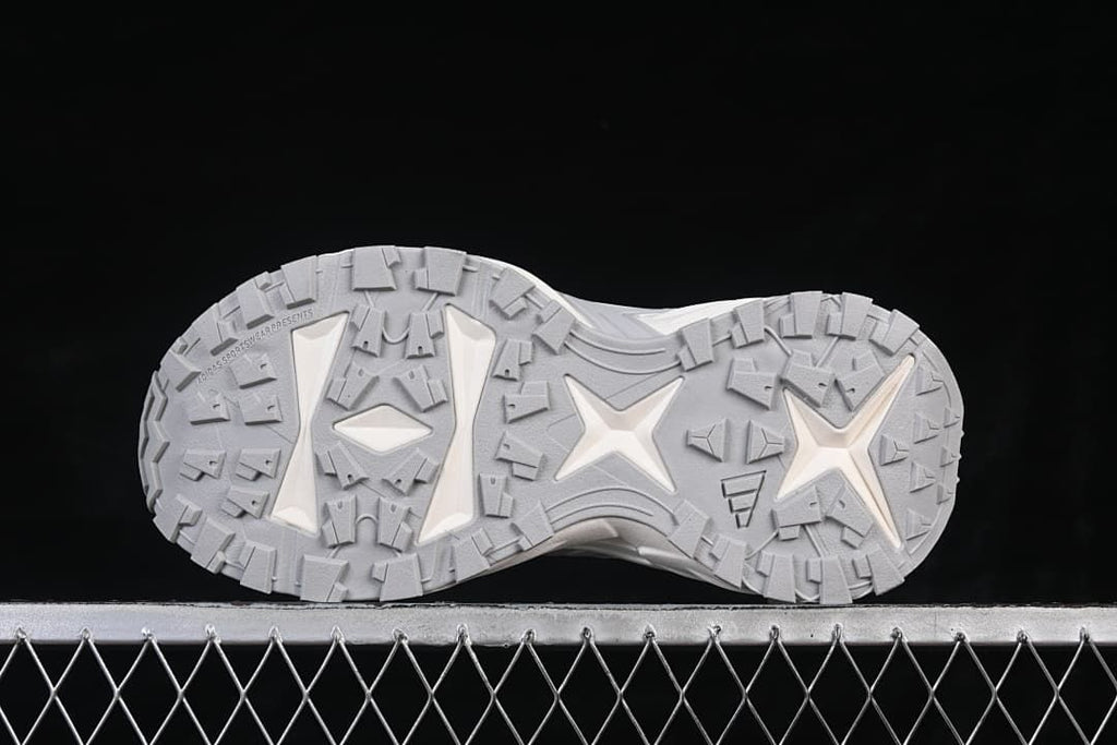 Underside view showing the grey patterned outsole