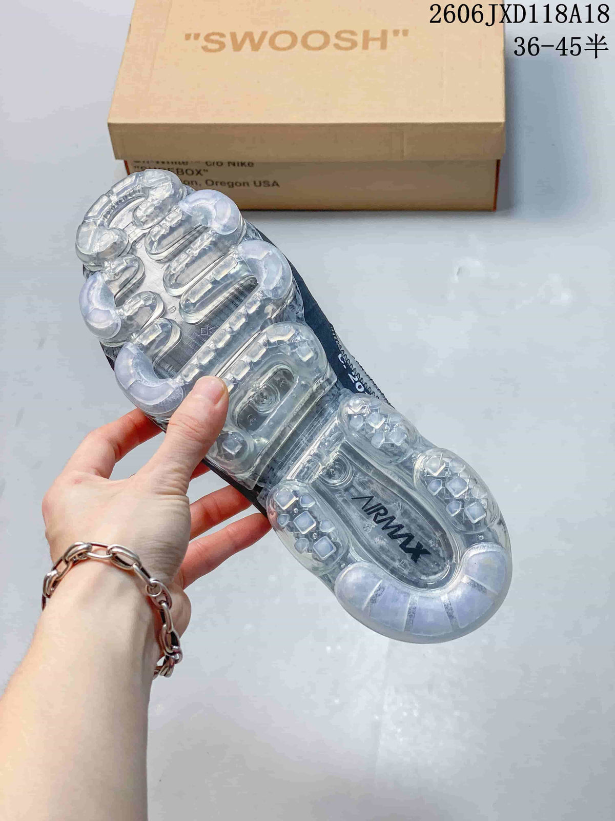 Underside of a Nike Air VaporMax sneaker showing its transparent segmented sole