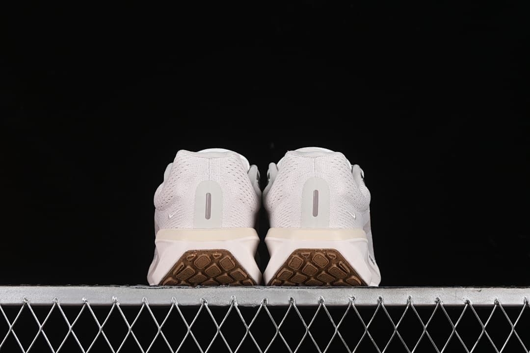 Rear view of the pair showing the heels and outsole sections.