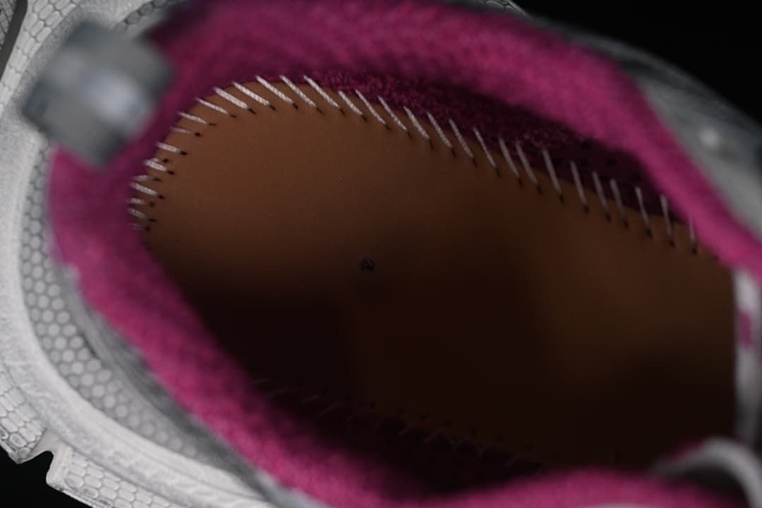 Interior close-up showing the pink lining and insole stitching