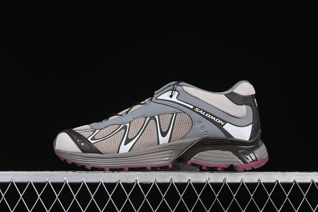 Side view of Salomon XT-Whisper trail running shoe in gray, taupe, black, and white with a berry outsole.