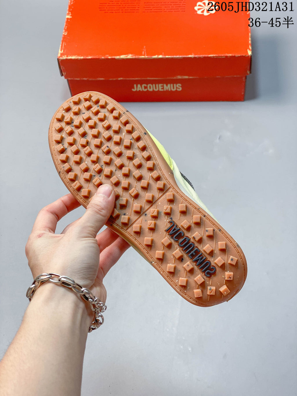 Close-up of the gum-colored outsole with raised tread on the Nike x Jacquemus sneakers