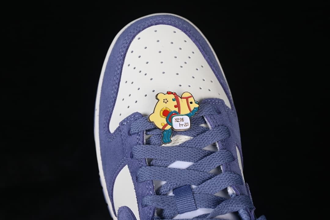 Top view of the perforated toe and horse-themed lace accessory