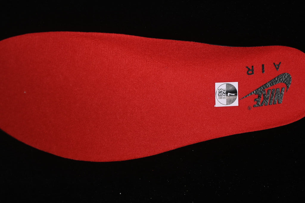 Red insole with visible Nike Air branding and a size sticker