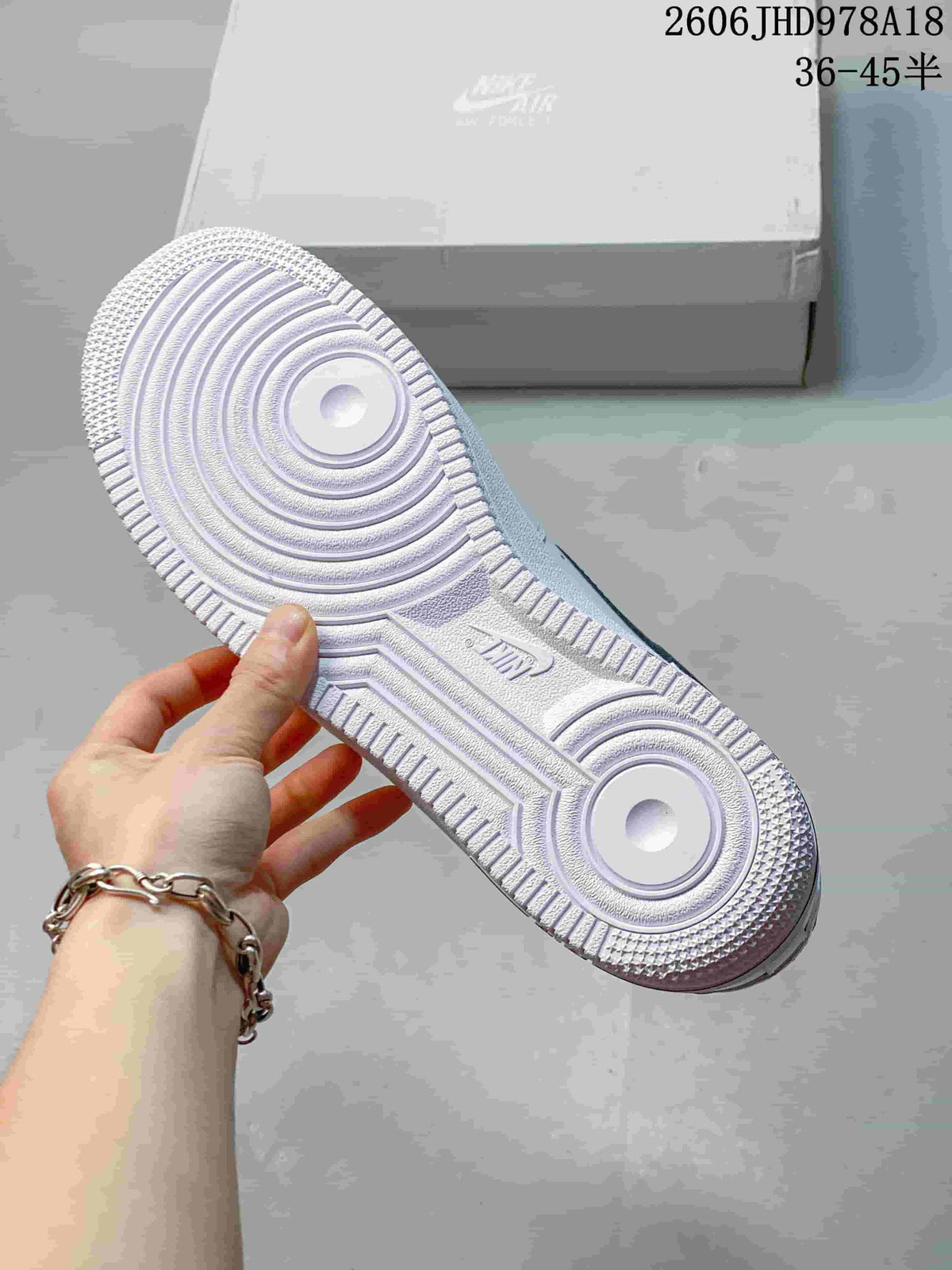 Close-up of the patterned white outsole of a Nike Air Force 1 sneaker