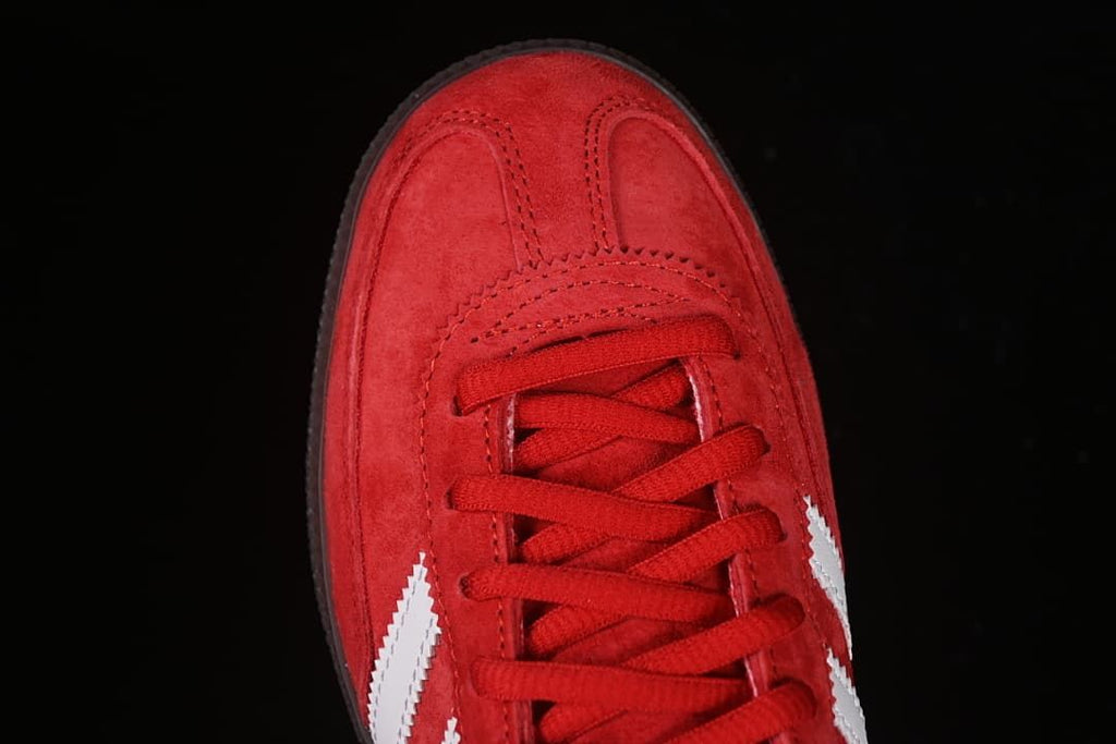 Overhead view of the red suede-look toe and lace area