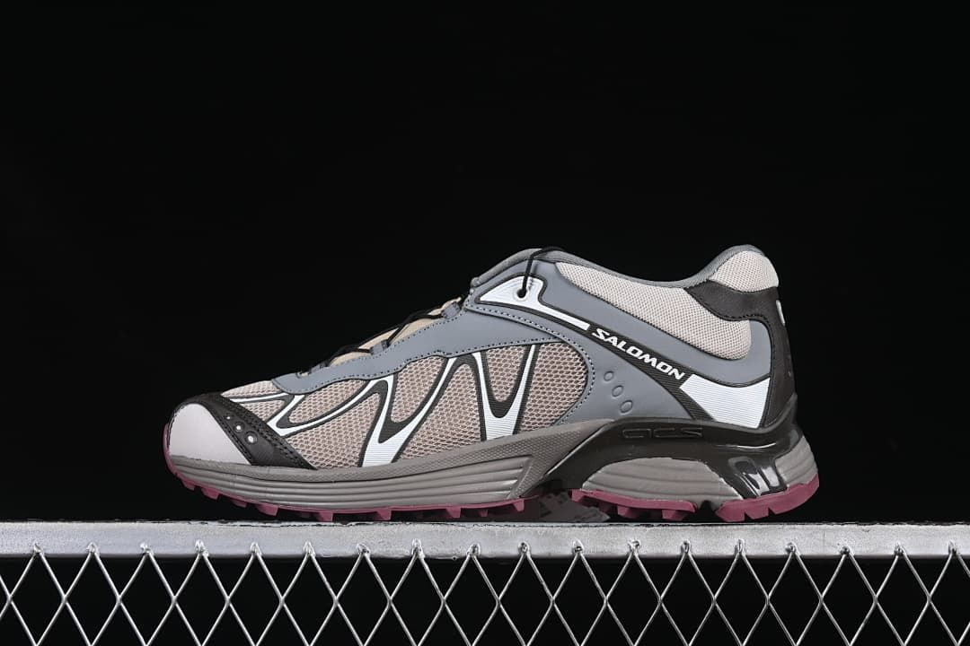 Side view of the Salomon XT-Whisper shoe against a dark background.