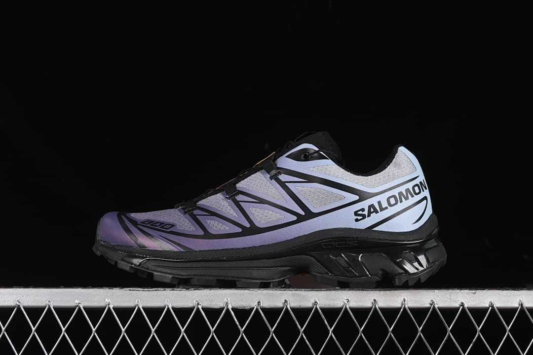 Side view of the Salomon XT-6 in gray, blue-violet, and black.