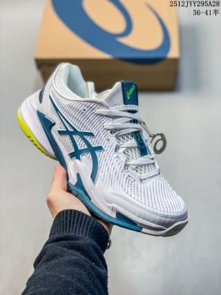 White and teal ASICS SKY ELITE FF 3 sneaker held in front of its shoebox.