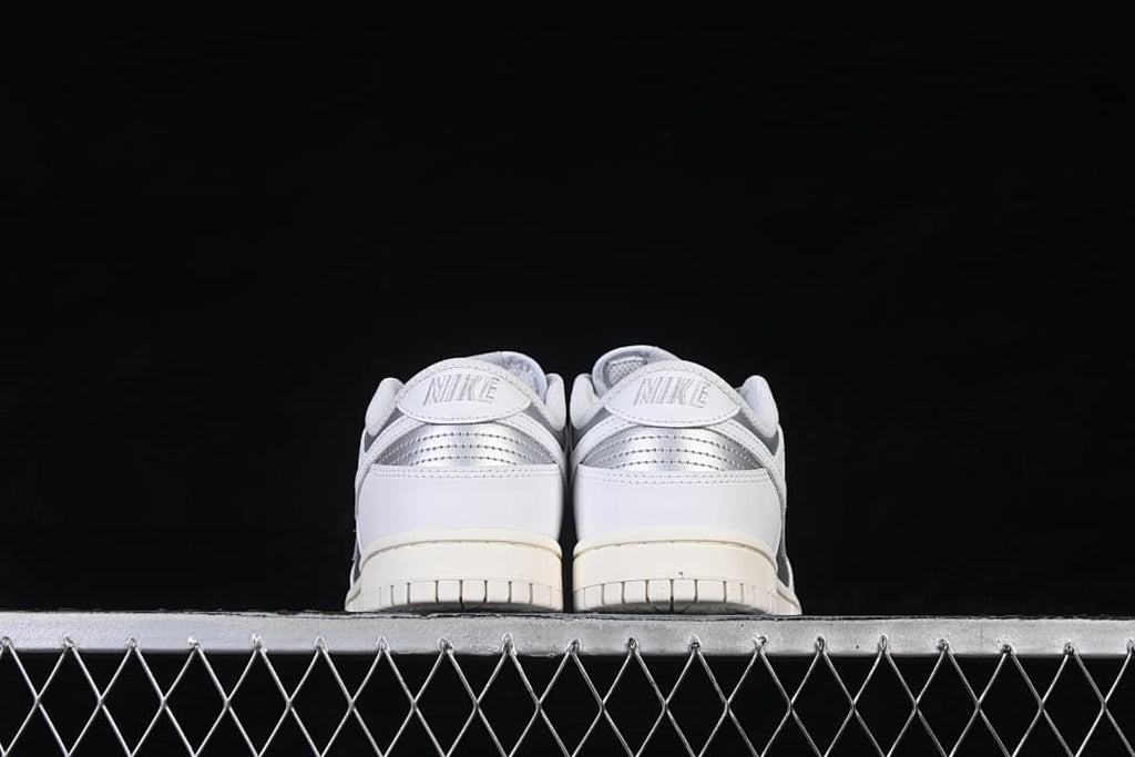 Rear view of both sneakers with silver heel accents