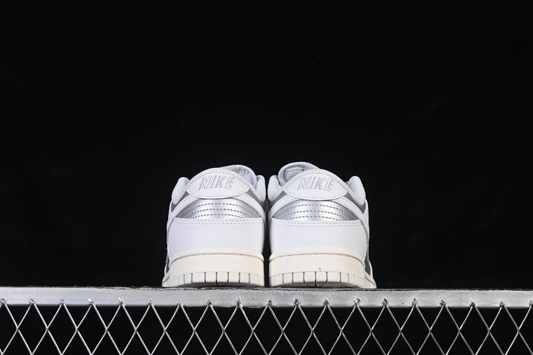 Rear view of both sneakers with silver heel accents