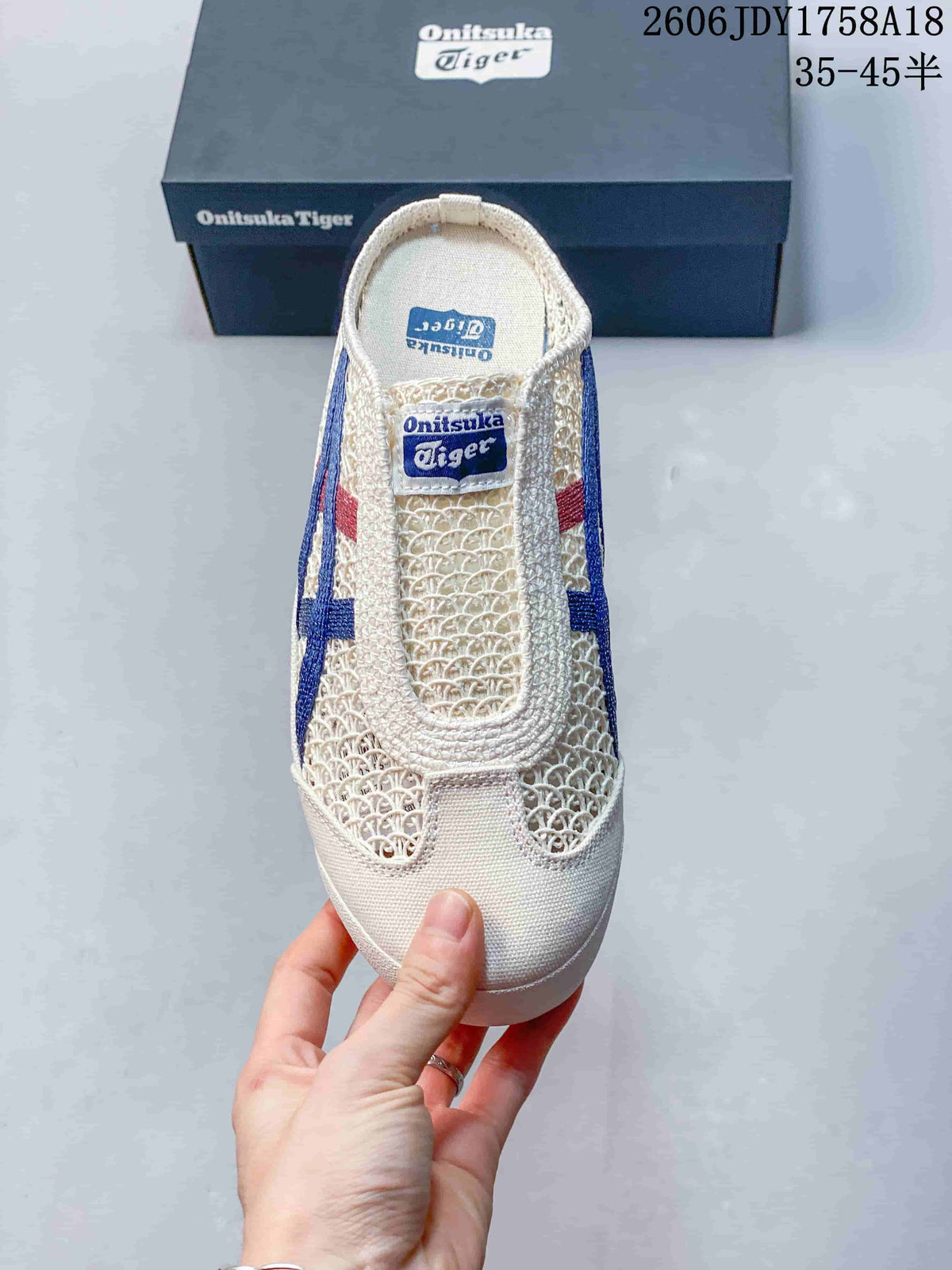 Top view of an ivory Onitsuka Tiger slip-on sabot with woven-look panels