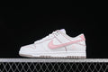 Side view of a white and pink Nike SB Dunk Low sneaker