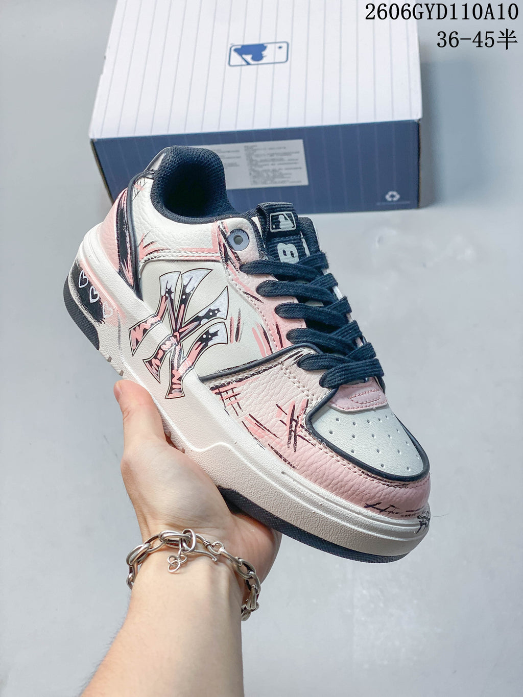 Angled side view highlighting the sneaker’s graphic side detail and chunky sole