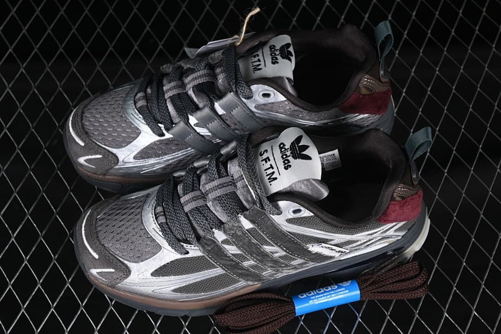 Pair of adidas Adistar Cushion sneakers shown from above, highlighting the mesh toe panels and layered lacing.