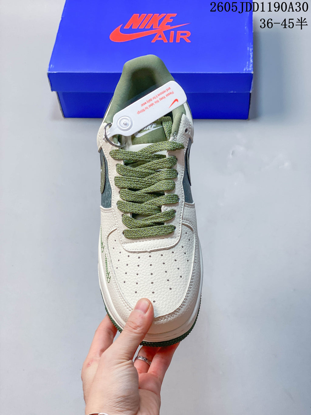 Top view of the sneaker showing its perforated toe and green laces